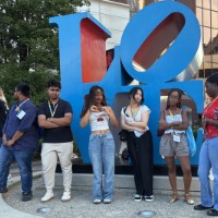 Group of students posing near LOVE sculpture